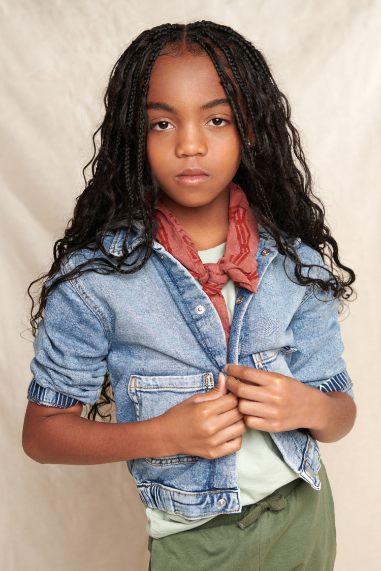 photo of African American child modeling clothes. Makeup by Traci Fine