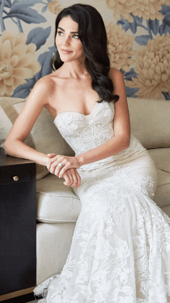 Bride with natural, smokey eye makeup, sitting on a couch at The Peninsula Hotel in Chicago