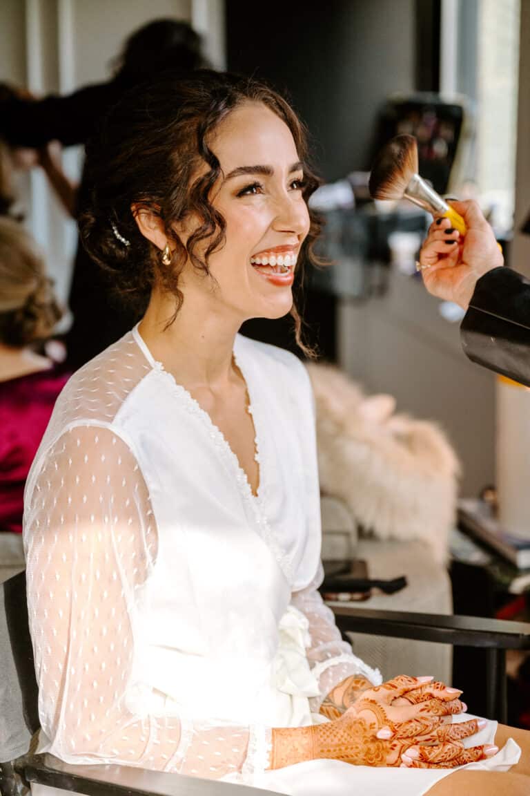 Bride having her makeup done on her Wedding Day by Chicago makeup artist Traci Fine