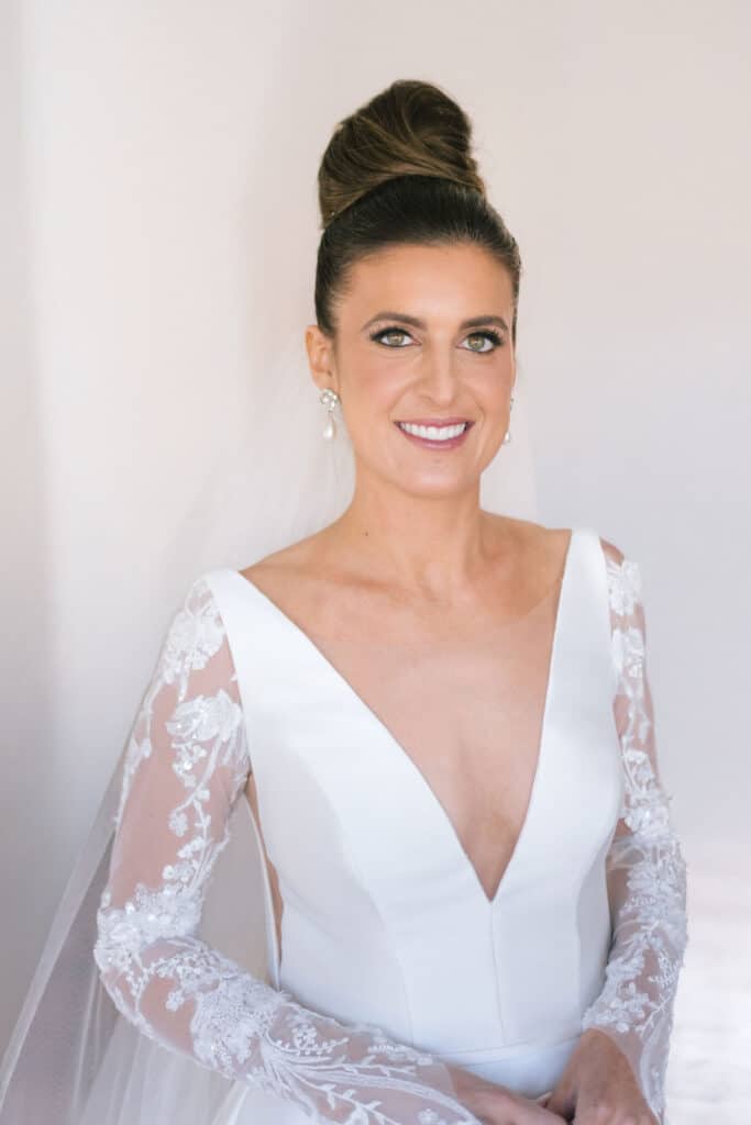 Greek American Bride in her wedding dress, up-do hairstyle and bridal makeup