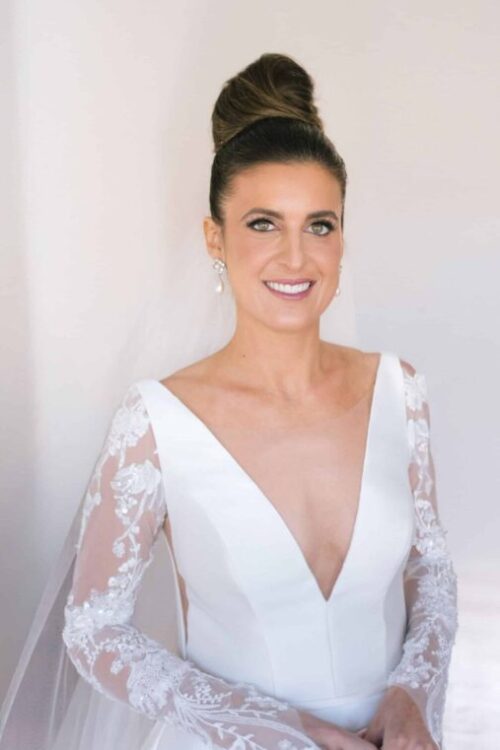 Greek American Bride in her wedding dress, up-do hairstyle and bridal makeup