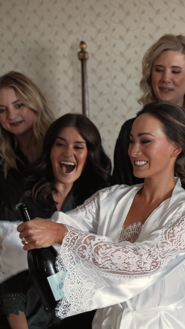 Bride pops the champagne and the Groom smashes the glass at a Jewish wedding at The Drake Hotel Chicago