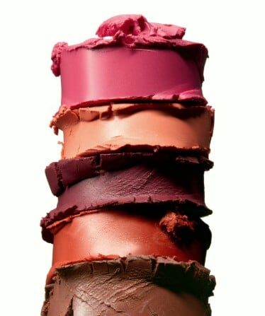 swatches of cream makeup vertically stacked against a white background