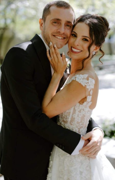 Bride and Groom hugging and smiling in the Art Institute of Chicago, South Garden.