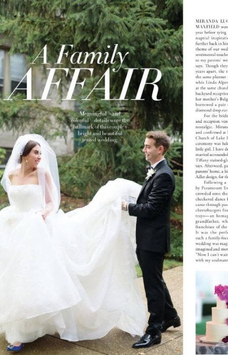 Groom carrying the Bride's wedding dress train in front of their Lake Forest, IL home